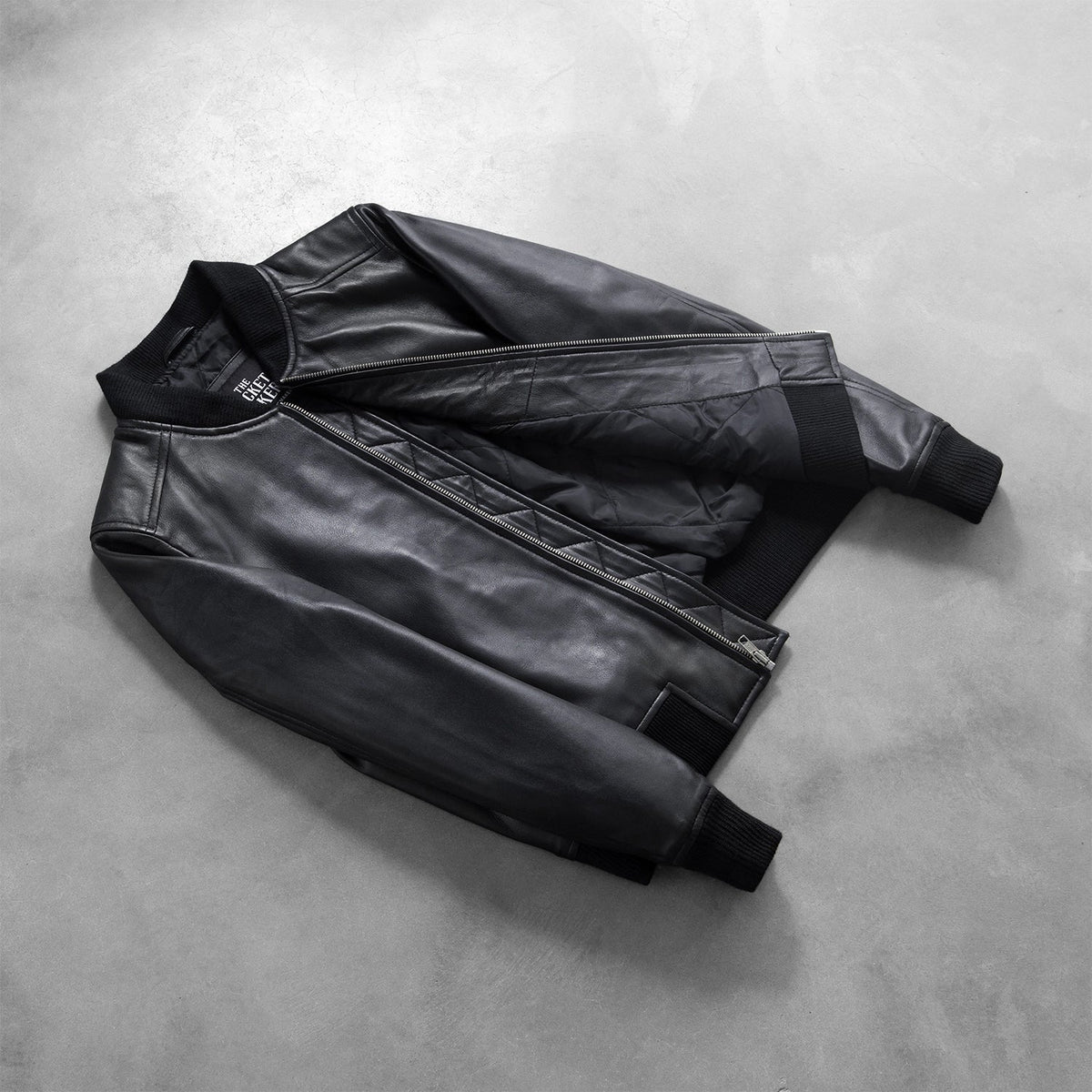 
Styled Fit Perspective of Women's Bliss Black Leather Bomber Jacket on Model - Natural Daylight Drape