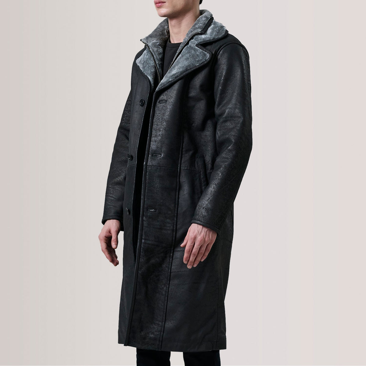 Cai Distressed Black Leather Shearling Coat For Men - Lateral Side Profile View Showing Sleeve Cut &amp; Athletic Taper Fit