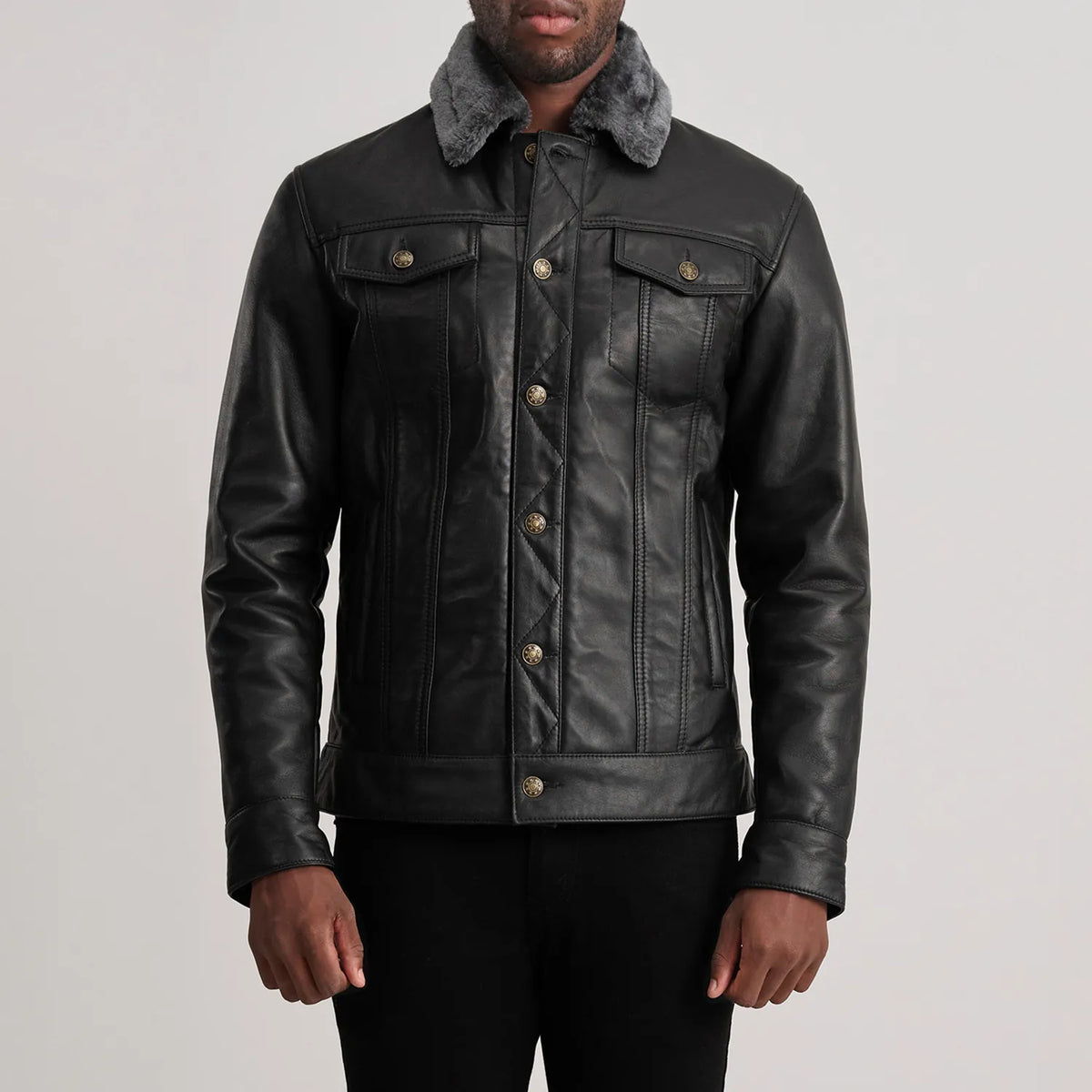 
Close-Up Detail of Classic Collar & Button Hardware on Dallis Black Leather Shearling Trucker Jacket