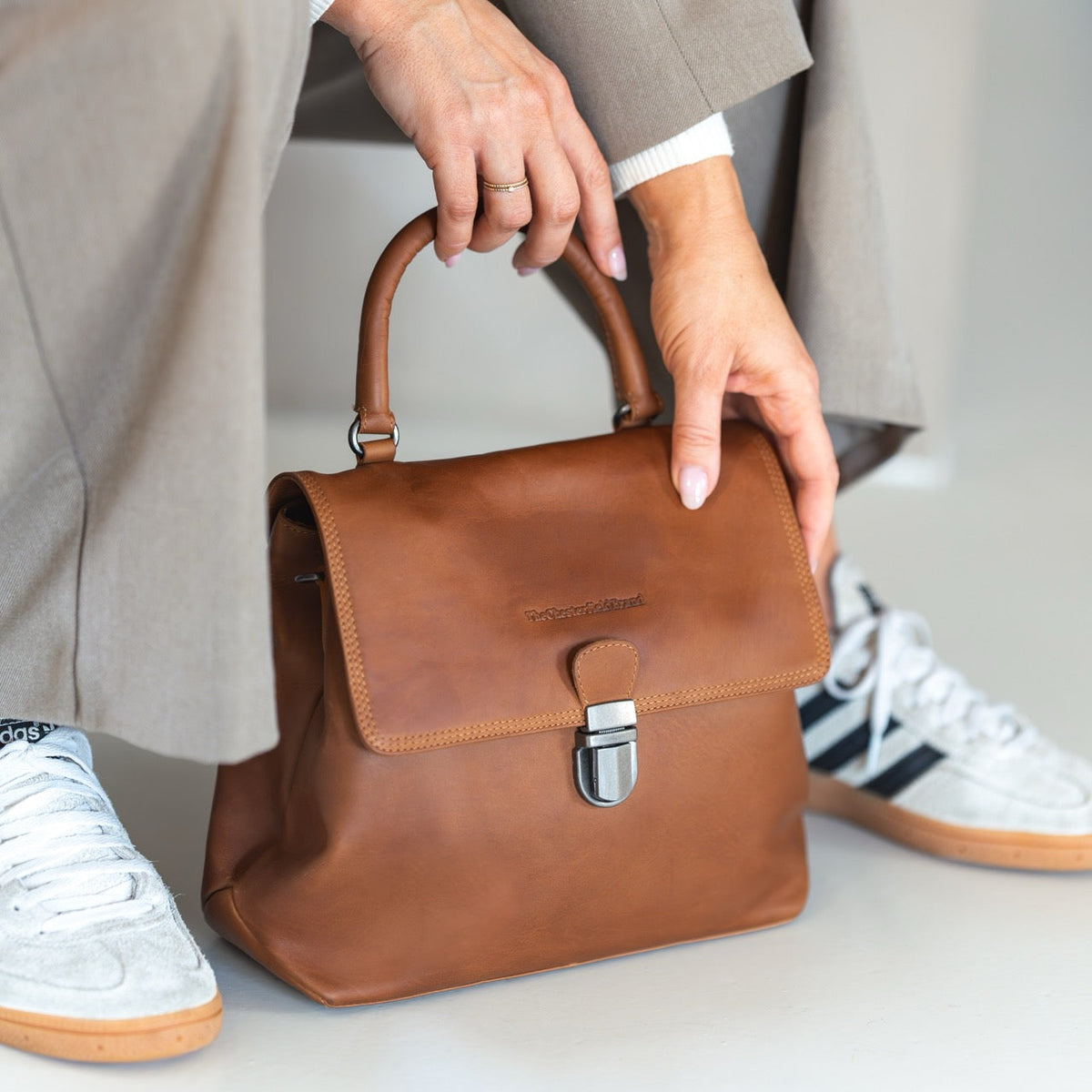 Styled Fit Perspective of Angera Full-Grain Leather Handbag on Model - Natural Daylight Drape