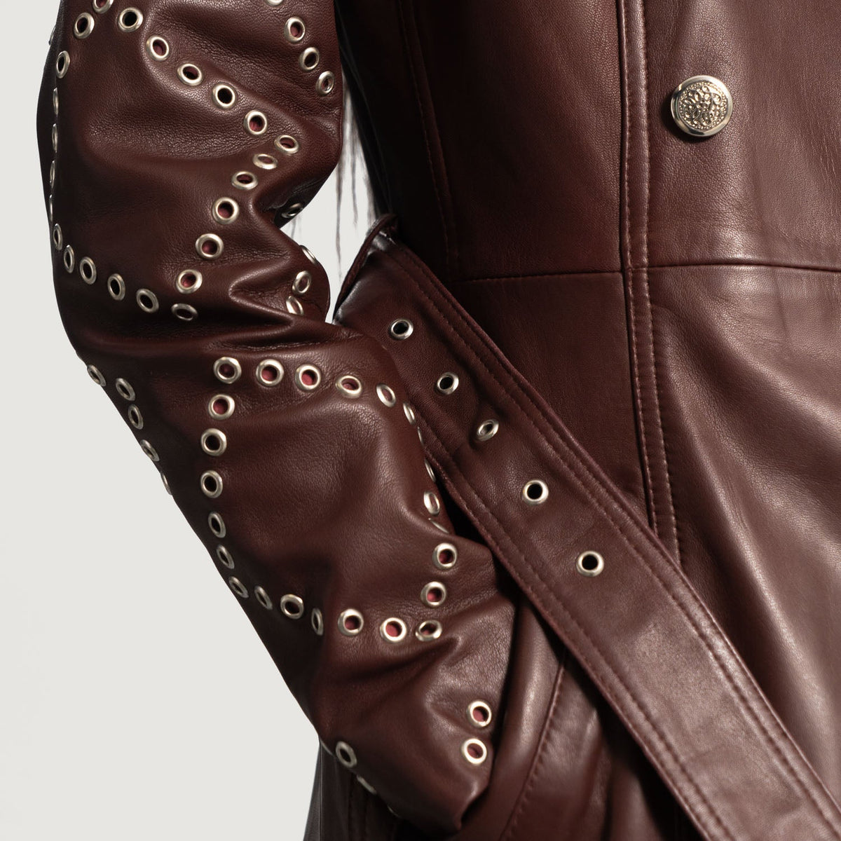 Close-Up Detail of Notch &amp; Button &amp; Waist belt Hardware on Women's Missoni Maroon Leather Trench Coat