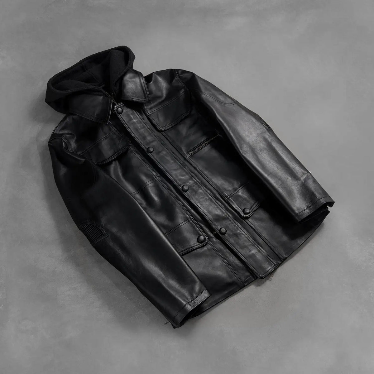 
Zipper & Hem Craftsmanship Construction Detail on Men's Moulder Hooded Black Leather Jacket