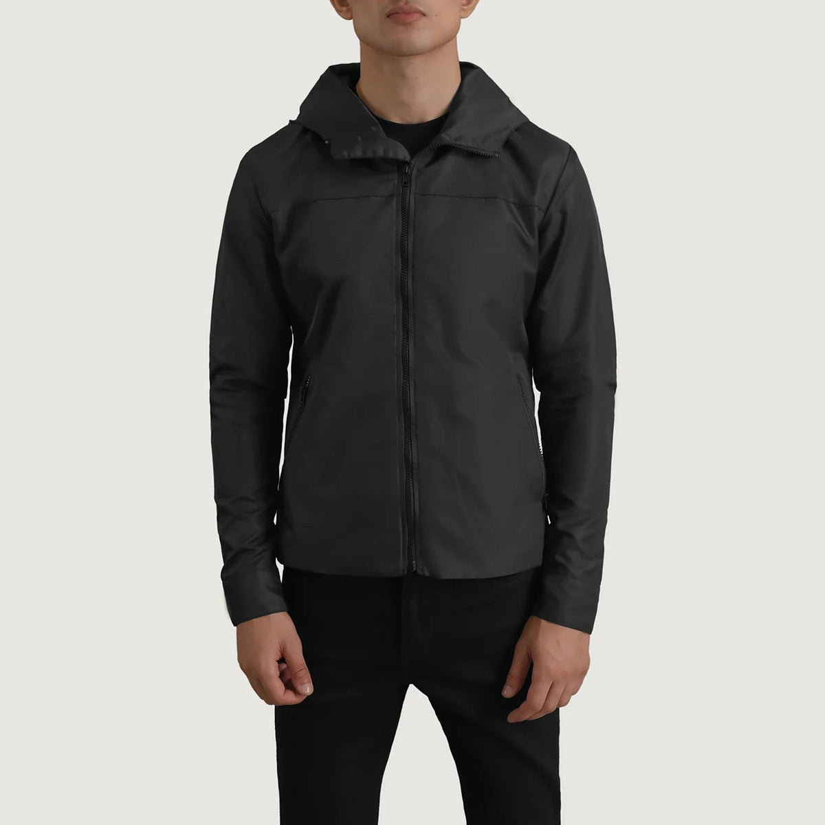 
Close-Up Detail of Classic Collar & Zipper With Inside Wind Flap. Hardware on Wesley Black Hooded Windbreaker Jacket